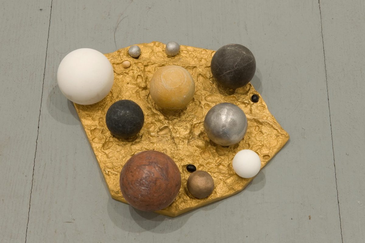 <i>principio</i>, 2008</br>golden bronze, aluminium, marble, bronze seeds</br> 1 x 22 x 28 c, / 0.4 x 8.7 x 11 in