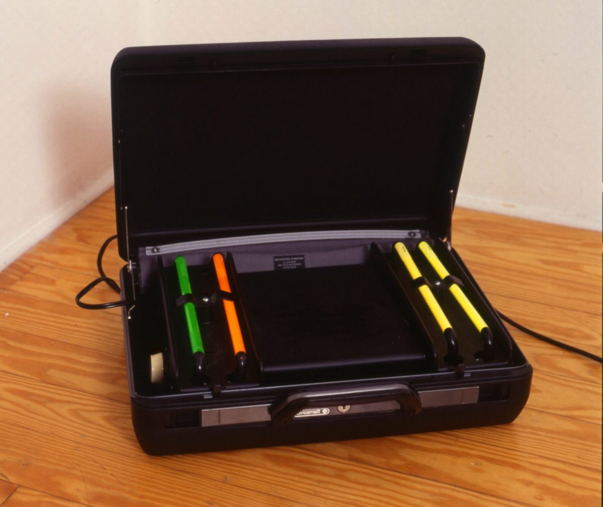 pae white, indian corn social, 2001
samsonite case, neon, keys, 15 x 37 x 48 cm
