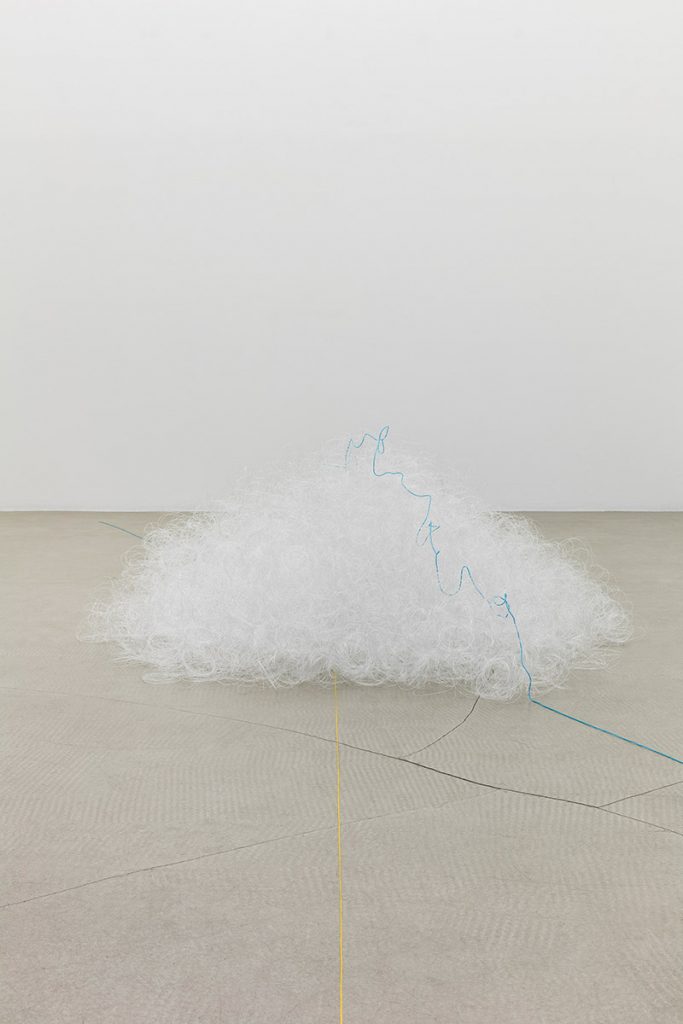 <i>l'orizzonte si posa su una nuvola mentre il sole la attraversa</br>the horizon lays on a cloud while the sun is crossing</i>, 2016</br>fishing line, light blue and yellow cotton thread</b>170 x 130 x 55 cm / 66.9 x 51.1 x 21.6 in