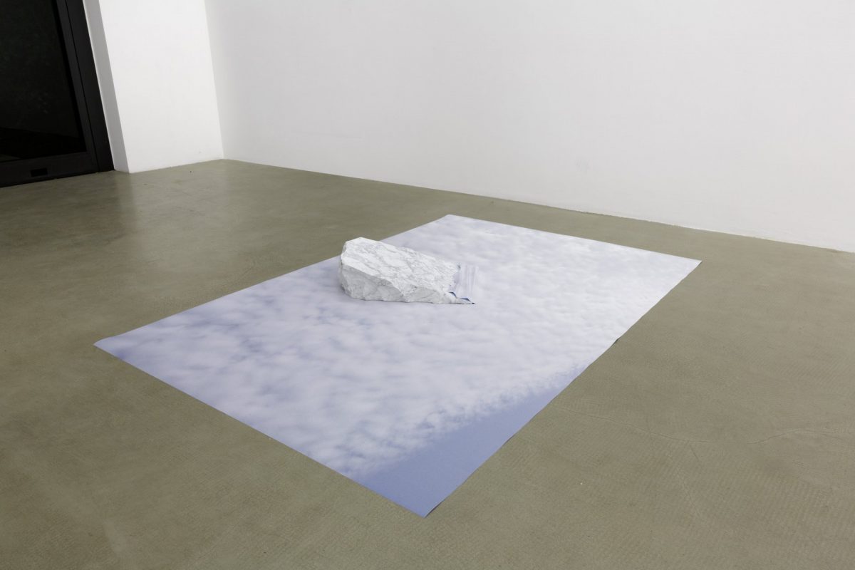 <i>sotto la superficie, la verità della concretezza (trentino)</br>(under the surface, the truth of concreteness (trentino)</i>, 2013</br>print on blueback paper, carrara's marble</br>16 x 224 x 150 cm / 6.3 x 88.1 x 59 in