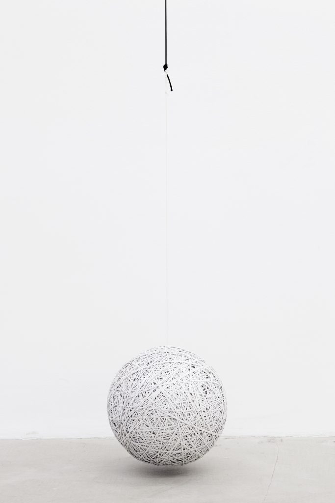 <i>by way of total withdrawal</i>, 2012</br>
layered cut-out photographic paper, cord</br>diam. 30 cm