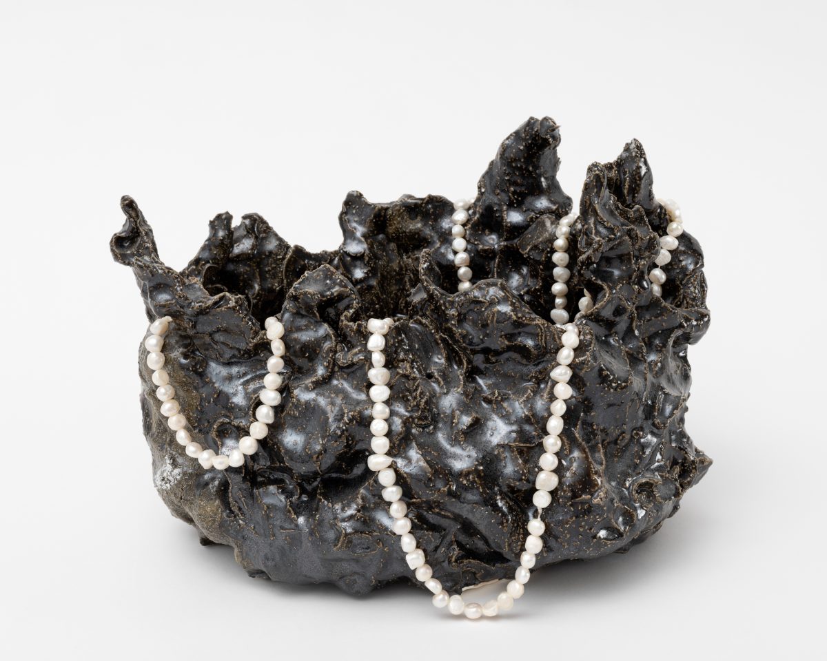 <i>Wish vase - energies,</i> 2025</br>
glazed ceramic and fresh water with pearls</br>
protocol: put your hands in front of your face. </br>whisper a wish into your hands. collect the wish in your hands. </br>direct the wish into the vase. there are no restrictions on the amount of wishes.</br> 22,5 x 32,5 x 23 cm / 8.9 x 13 x 9 in