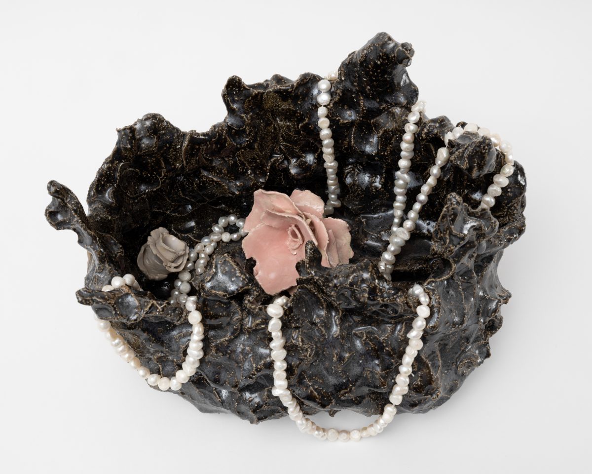 <i>Wish vase - energies,</i> 2025</br>
glazed ceramic and fresh water with pearls</br>
protocol: put your hands in front of your face. </br>whisper a wish into your hands. collect the wish in your hands. </br>direct the wish into the vase. there are no restrictions on the amount of wishes.</br> 22,5 x 32,5 x 23 cm / 8.9 x 13 x 9 in