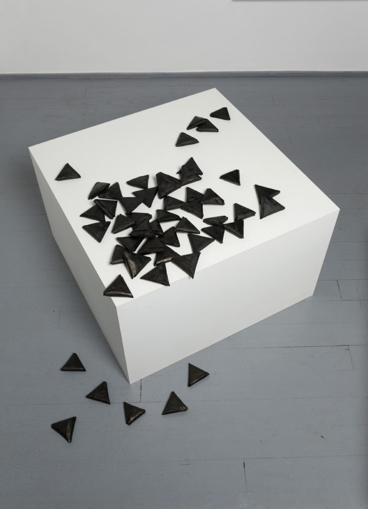 <i>les petites lettres</i>, 2009
</br>
48 pieces of folded paper dyed with black chinese ink, mdf pedestal pedestal, 
</br> 43 x 70 x 70 cm / 16.9 x 27.5 x 27.5 in >