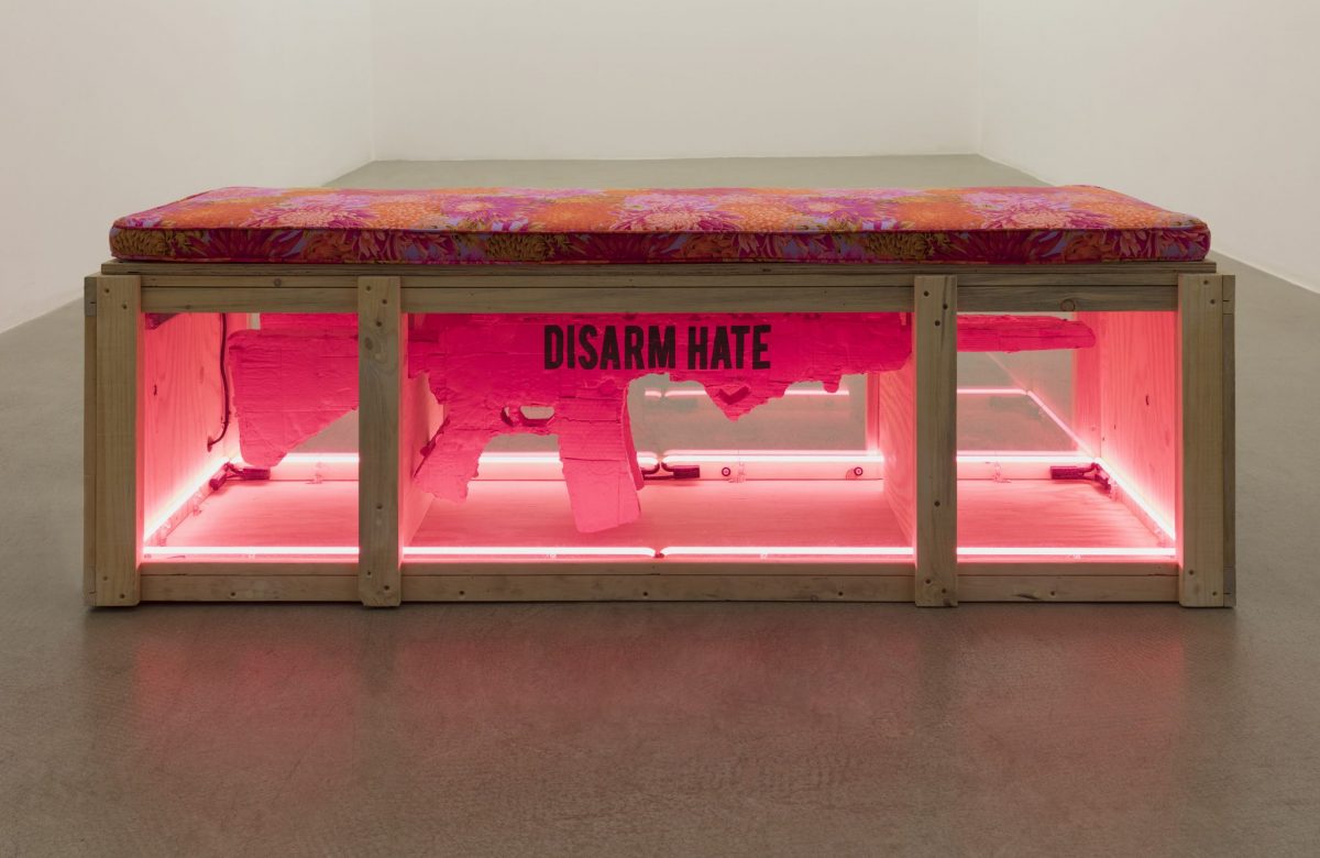 <i>gun bench (code pink protest props in support of march for our lives,</br>remembering marjory stonemason douglas high school), 2018</br>reused wood, plexiglass, neon, cardboard, acrylic paint, cushion</br> 59,7 x 182,9 x 61 cm / 23.5 x 72 x 24 in