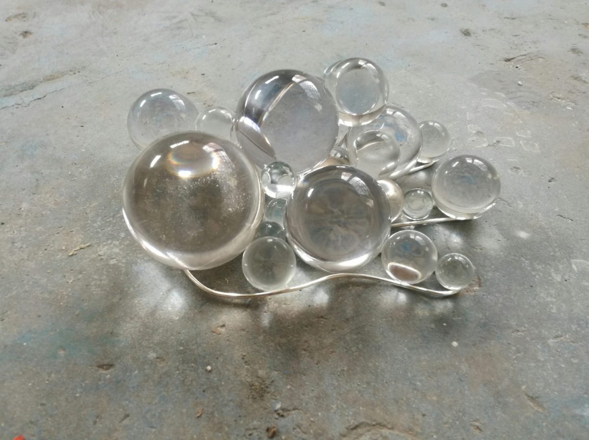 <i>giovane universo (young universe)</i>, 2016
</br>
glass spheres, silvered bronze, 10 x 25 x 22 cm / 4 x 9.8 x 8.7 in>