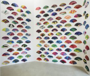 <i>feminist fans</i>, 2018 
</br>
spray painted fans, 5 series of 250 pieces, variable dimensions