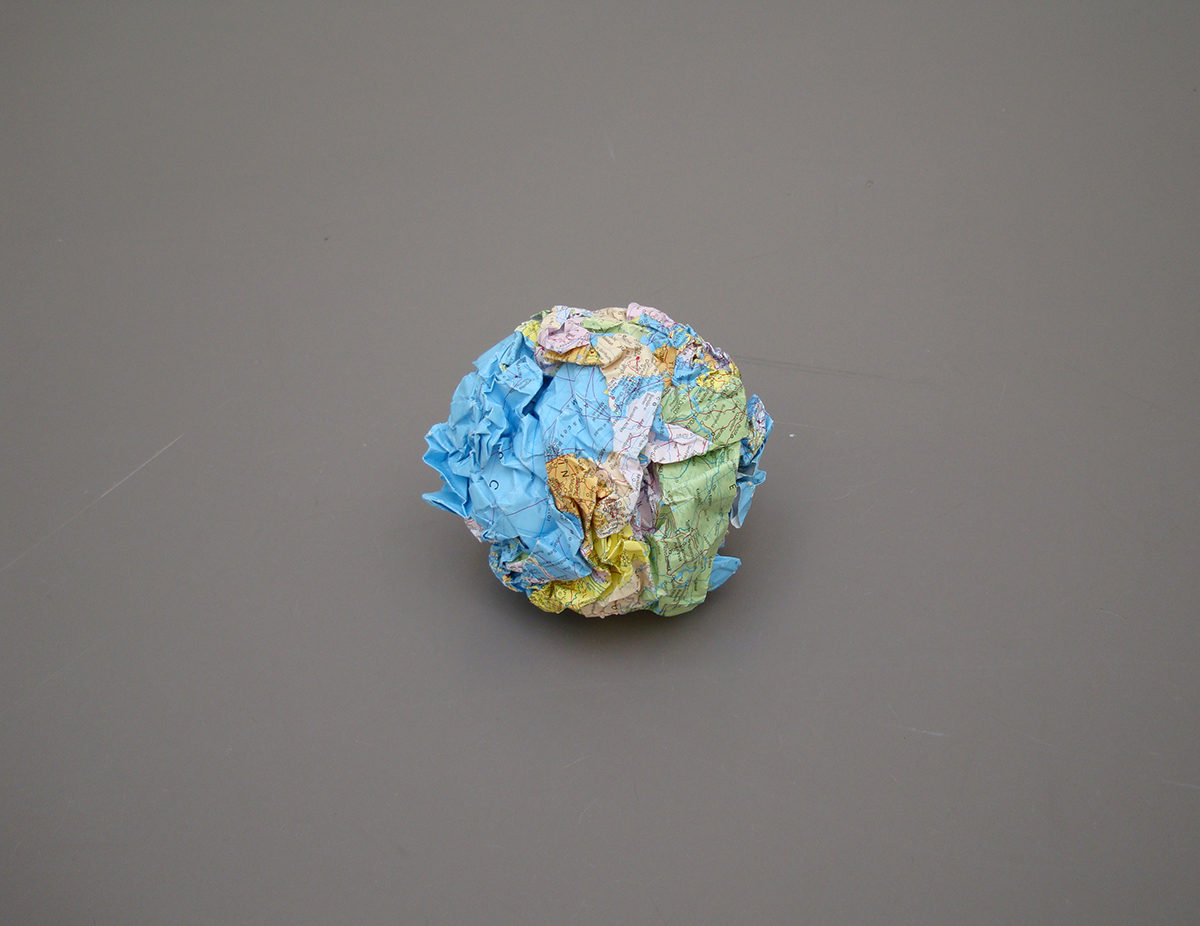 <i>globus</i>, 2014
</br>
crumpled map of the world, printed paper, diameter 18 cm / 7 in >