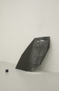 <i>dispositivo per creare spazio (space creator device)</i>, 2007
</br>
black belgian marble, wall plaster dust
</br>
121 x 110 x 5 cm / 47.6 x 43.3 x 2 in