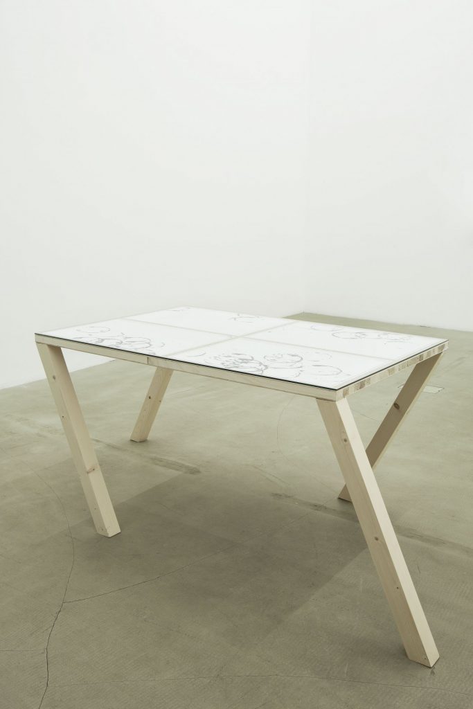 <i>walking table 1</i>, 2012 
</br>
table, glass, four drawings
</br>
192 x 90 x 73,5 cm / 75.6 x 35.4 x 28.9 in>
