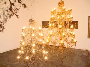 <i>prodigal sun and the other brother</i>, 2004 
</br>
platinum and golden chandelier, mixed hardware
</br>
170 x 110 cm / 66.9 x 43.3 in 
