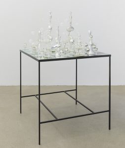 <i>yield event</i>, 2014 
</br>
steel, 35 glass chess pieces, table: 81 x 81 cm / 31.9 x 31.9 in