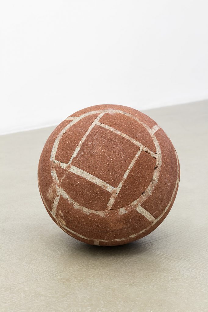 <i>ball in remembrance of annette wehrmann</i>, 2016</br>
bricks, cement, red clay,</br>37 cm diameter