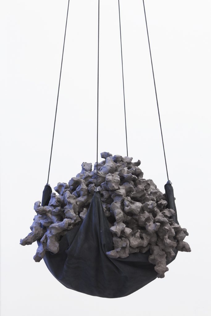 <i>the making of us</i>, 2012</br>
clay, leather, cord</br>diam. 65 m, height 50 m