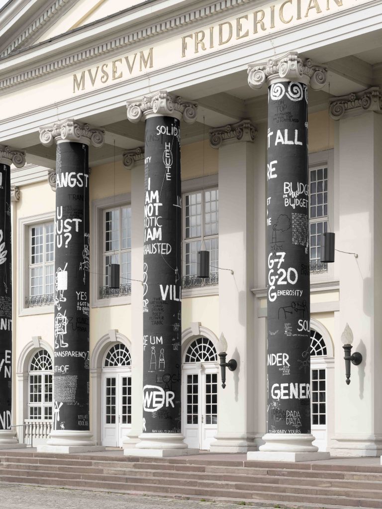 <i>documenta fifteen: Dan Perjovshi, Generosity, Regeneration, Transparency, Independence, Sufficiency, Local Anchor and most of all Humor</i>, 2022
</br> installation view, Fridericianum, Kassel