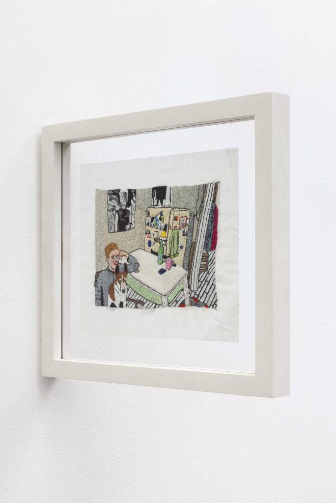 LJ Roberts, <i>Alice O'Malley in her kitchen with Nelson</i>, 2015</br>embroidery on cotton</br>
image: 11,4 x 15,5 cm / 4.4 x 6.1 in
cloth: 16,5 x 20,5 cm / 6.4 x 8 in
framed: 27,9 x 25 x 2,5 cm / 11 x 9.8 x 0.9 in