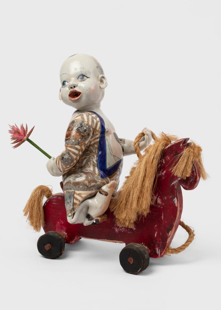<i> Thalidomide Warrior</i>, 2004 </br> porcelain, rubber, rope, and wood </br> 55,9 x 55,9 x 26,7 cm / 22 x 22 10.5 in>