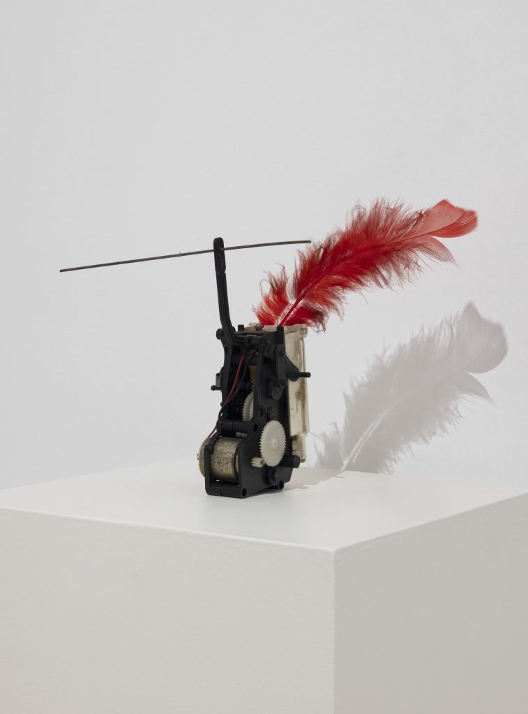 <i>Macchina Aritmica</i>, 1950 </br>
battery mechanism, metal and feather </br>
22 x 15 cm / 8.6 x 5.9 in